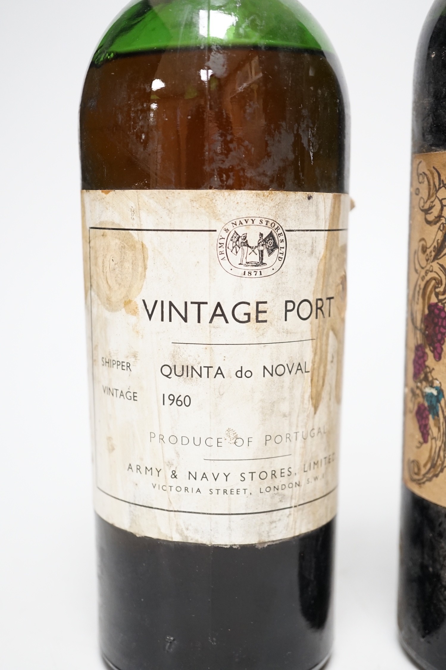 A bottle of Army and Navy stores 1960 vintage port and a bottle of Chateau Calon-Segur 1962